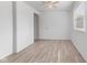 Bedroom featuring a ceiling fan, natural light, neutral paint, and updated floors at 3705 Lima Ct, Indianapolis, IN 46227
