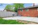 Paved backyard patio of a red brick home, perfect for outdoor entertaining and relaxation at 4213 N Audubon Rd, Indianapolis, IN 46226