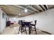 This finished basement is ready with a table and chairs, perfect for entertaining or relaxing at 4213 N Audubon Rd, Indianapolis, IN 46226