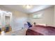 This is a cozy bedroom with a glimpse of a hallway and warm natural lighting at 4213 N Audubon Rd, Indianapolis, IN 46226