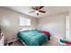 This bedroom offers a ceiling fan and a comfortable bed for relaxation and rest at 4213 N Audubon Rd, Indianapolis, IN 46226