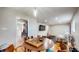 Open dining area with hardwood floors, stylish decor, and a view into the adjacent living room at 4213 N Audubon Rd, Indianapolis, IN 46226