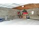 Spacious garage interior with concrete block walls, ready for storage or hobbies at 4213 N Audubon Rd, Indianapolis, IN 46226