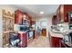 Well-equipped kitchen with stainless steel appliances, granite countertops, and dark wood cabinets at 4213 N Audubon Rd, Indianapolis, IN 46226