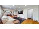 Cozy living room features hardwood floors, a comfy couch, and a dining area at 4213 N Audubon Rd, Indianapolis, IN 46226