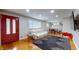 Inviting living room boasts hardwood floors, a comfortable sofa, and ample natural light at 4213 N Audubon Rd, Indianapolis, IN 46226