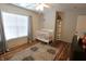 Bedroom featuring a ceiling fan, large window, and a stylish area rug at , Greenwood, IN 46143
