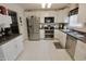 Kitchen with stainless steel appliances and white cabinets and countertops at , Greenwood, IN 46143