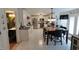 Spacious eat-in kitchen featuring white cabinets, stainless steel appliances, and a dining table at , Greenwood, IN 46143