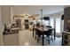 Spacious eat-in kitchen featuring white cabinets, stainless steel appliances, and a dining table at , Greenwood, IN 46143