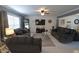 Open-concept living room offers bright white ceramic tile, modern furniture and lots of natural light at , Greenwood, IN 46143