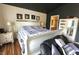 Bedroom with custom accent wall, unique ceiling and wood flooring at , Greenwood, IN 46143