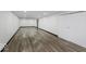 Finished basement with white walls, vinyl floors and storage at 4337 N Audubon Rd, Indianapolis, IN 46226