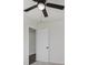 Bedroom featuring carpet, a door, a window for natural light, and a ceiling fan at 4337 N Audubon Rd, Indianapolis, IN 46226