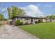 Exterior shot of renovated house including new landscaping and expansive front lawn at 4337 N Audubon Rd, Indianapolis, IN 46226