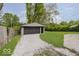 Garage with gravel driveway and green grass at 4337 N Audubon Rd, Indianapolis, IN 46226