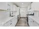 Modern kitchen with stainless steel appliances, white cabinetry, and quartz countertops at 4337 N Audubon Rd, Indianapolis, IN 46226