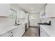 Bright kitchen featuring white cabinets, stainless steel appliances, and modern countertops at 4337 N Audubon Rd, Indianapolis, IN 46226
