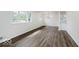 Bright, open-concept living area with hardwood floors and a view into the modern kitchen at 4337 N Audubon Rd, Indianapolis, IN 46226