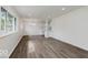 Bright, open-concept living area with hardwood floors and a view into the modern kitchen at 4337 N Audubon Rd, Indianapolis, IN 46226