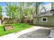 Large backyard with garden boxes, playhouse, and patio at 4447 N College Ave, Indianapolis, IN 46205