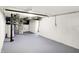 Spacious basement with painted walls, grey floor, and visible ductwork, providing ample potential for customization at 4447 N College Ave, Indianapolis, IN 46205