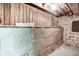 Basement with unfinished walls and wooden beams, perfect for storage or future renovation projects at 4447 N College Ave, Indianapolis, IN 46205