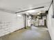 Unfinished basement with concrete floor and walls, HVAC, and water heater offering ample storage and utility access at 4447 N College Ave, Indianapolis, IN 46205