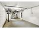 Unfinished basement with furnace, water heater, concrete floor and walls, and easy access for utilities maintenance at 4447 N College Ave, Indianapolis, IN 46205
