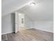 Bedroom with a door and closet, light gray walls and wood look floor at 4447 N College Ave, Indianapolis, IN 46205
