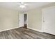 Clean, uncluttered bedroom with new floors, fresh paint, and two doors, creating an open and inviting space at 4447 N College Ave, Indianapolis, IN 46205