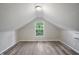 A well-lit bedroom showcasing neutral gray walls and a contemporary air conditioning unit at 4447 N College Ave, Indianapolis, IN 46205