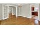 Open dining room with hardwood floors, decorative chandelier, and easy access to the kitchen at 4447 N College Ave, Indianapolis, IN 46205