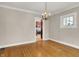 Charming dining space with hardwood floors and a view of the kitchen at 4447 N College Ave, Indianapolis, IN 46205