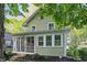Charming home featuring a screened-in porch and well-manicured landscaping at 4447 N College Ave, Indianapolis, IN 46205
