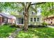 Beautiful home with a tree swing hanging from a mature tree in the yard at 4447 N College Ave, Indianapolis, IN 46205