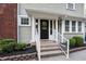 Inviting front entrance with white stairs and fresh landscaping at 4447 N College Ave, Indianapolis, IN 46205