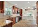 Well-lit kitchen boasts granite countertops, stainless steel appliances, and an open design at 4447 N College Ave, Indianapolis, IN 46205