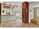Open-concept kitchen featuring wood cabinets and stainless steel appliances adjoins the living space at 4447 N College Ave, Indianapolis, IN 46205