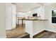 Updated kitchen featuring a view of the living area beyond at 4447 N College Ave, Indianapolis, IN 46205