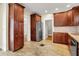 Spacious kitchen with stainless steel fridge, wood cabinets and granite countertops at 4447 N College Ave, Indianapolis, IN 46205