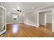 Bright and airy living room with hardwood floors and a classic ceiling fan at 4447 N College Ave, Indianapolis, IN 46205