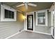 Enclosed porch featuring a ceiling fan and black framed window at 4447 N College Ave, Indianapolis, IN 46205