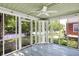 Relaxing screened porch with ceiling fan and view to the outside at 4447 N College Ave, Indianapolis, IN 46205
