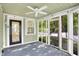 Inviting screened porch with ample natural light and serene outdoor views, enhancing relaxation at 4447 N College Ave, Indianapolis, IN 46205