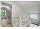 The staircase has white railing and leads to the bedrooms at 4447 N College Ave, Indianapolis, IN 46205