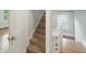 Bright interior shot of staircase in home with white walls and wood steps at 4447 N College Ave, Indianapolis, IN 46205