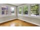 Charming sun room with multiple windows offering abundant natural light and scenic views at 4447 N College Ave, Indianapolis, IN 46205