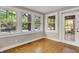 Inviting sun room filled with natural light from large windows, perfect for relaxation at 4447 N College Ave, Indianapolis, IN 46205