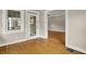 Bright sun room featuring beautiful wood floors and ample natural light from multiple windows at 4447 N College Ave, Indianapolis, IN 46205